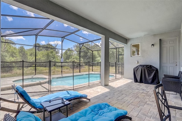 view of swimming pool with a patio area, area for grilling, glass enclosure, and a pool with connected hot tub