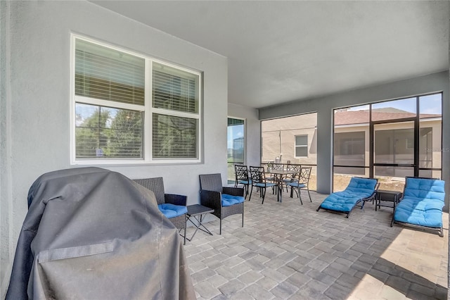 view of patio featuring outdoor dining area and a grill