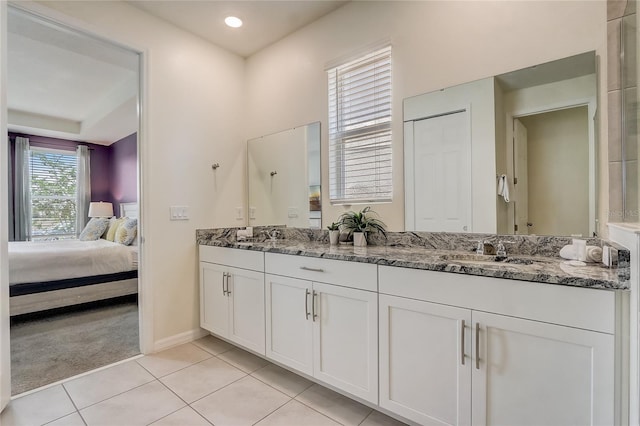 bathroom featuring tile patterned flooring and vanity