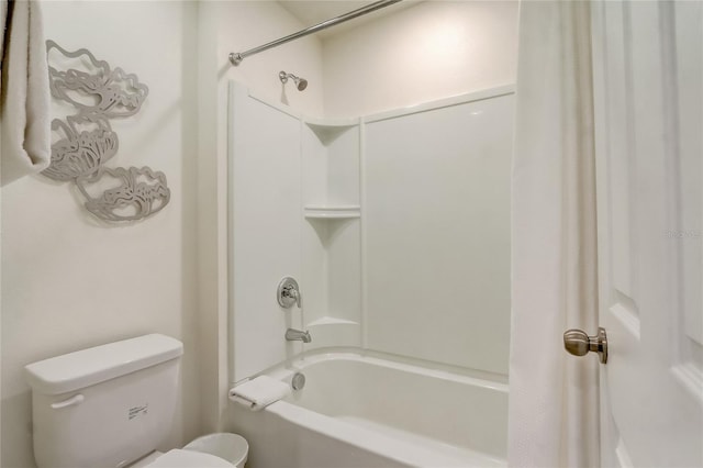 full bath featuring toilet and shower / bath combo with shower curtain