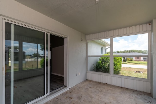 unfurnished sunroom with plenty of natural light