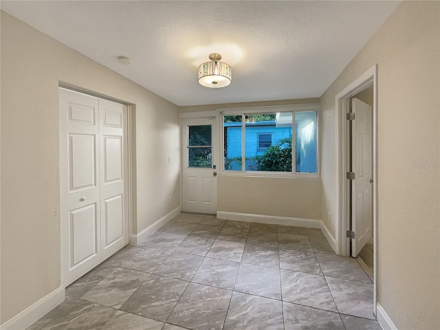 interior space with a textured ceiling