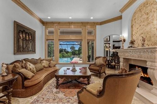 sitting room featuring crown molding