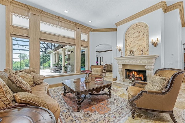 living room featuring ornamental molding and a textured ceiling