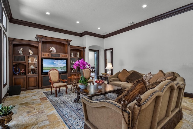 living room with ornamental molding and a textured ceiling