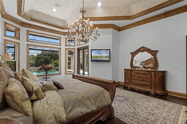 bedroom with crown molding, a tray ceiling, and dark hardwood / wood-style floors