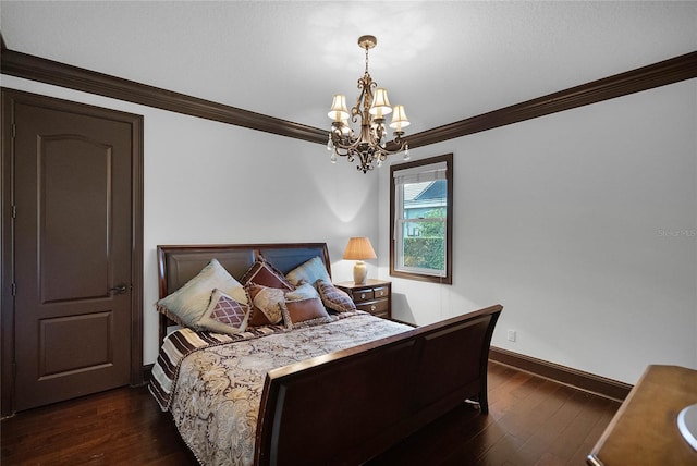 bedroom with ornamental molding, dark hardwood / wood-style floors, and a chandelier