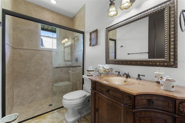 bathroom with vanity, an enclosed shower, and toilet