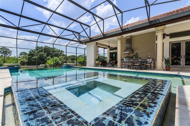 view of swimming pool featuring a patio, an in ground hot tub, french doors, and glass enclosure