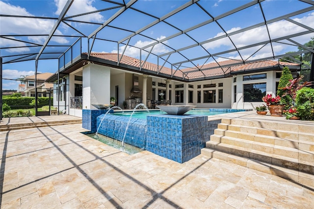 view of swimming pool with a patio, pool water feature, and a lanai