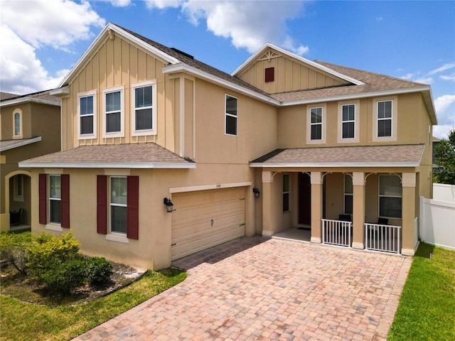 view of front facade with a porch and a garage