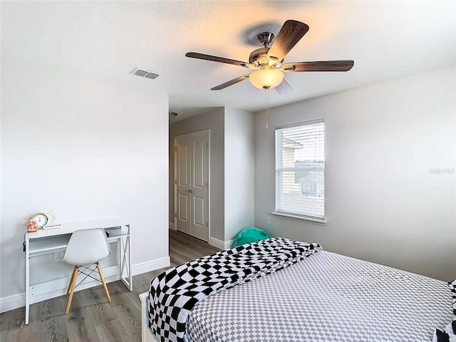 bedroom featuring hardwood / wood-style floors and ceiling fan