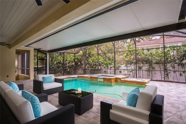 view of swimming pool with a pool with connected hot tub, an outdoor hangout area, a patio area, ceiling fan, and a lanai