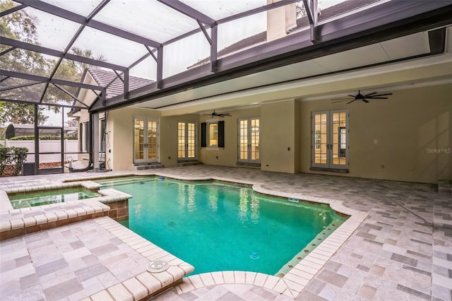 view of pool featuring a pool with connected hot tub, ceiling fan, a patio, and french doors