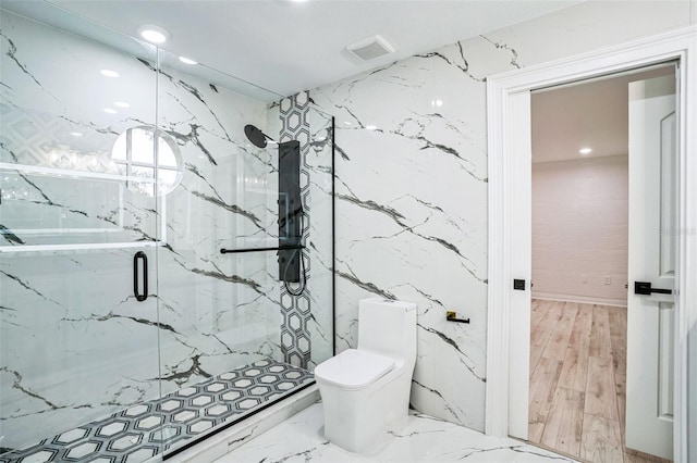 full bath with marble finish floor, a marble finish shower, visible vents, toilet, and stone wall