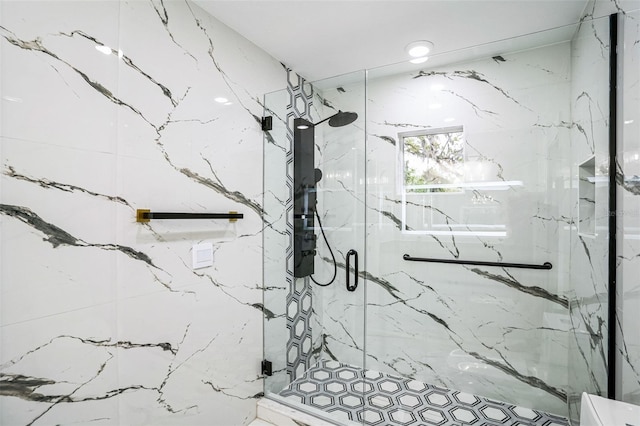 full bathroom with a marble finish shower