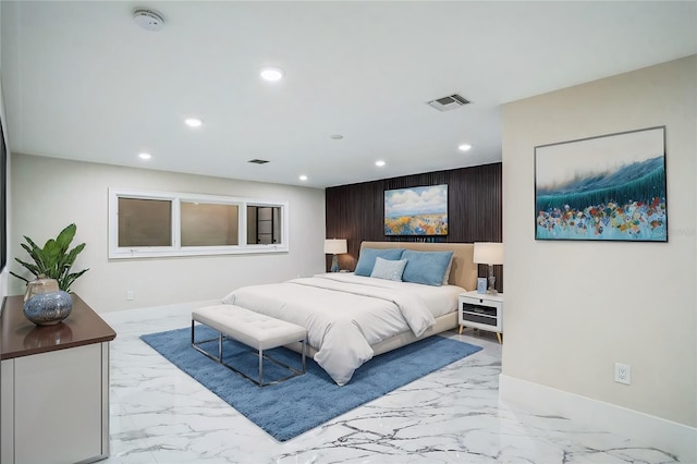 bedroom with marble finish floor, visible vents, and recessed lighting