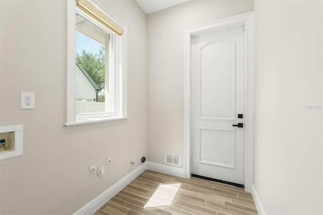 laundry room with laundry area, wood tiled floor, visible vents, gas dryer hookup, and hookup for a washing machine