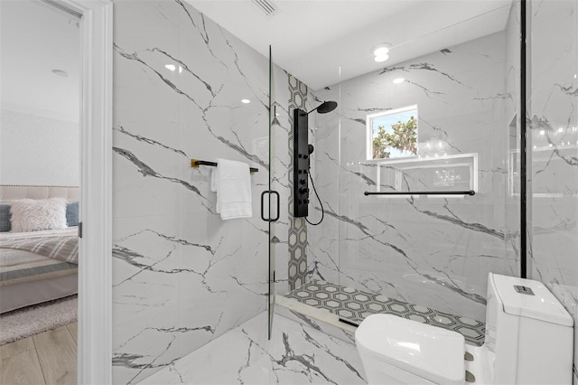 full bath with connected bathroom, toilet, tile walls, and a marble finish shower