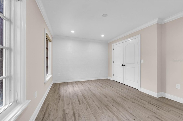 unfurnished room with recessed lighting, ornamental molding, baseboards, and light wood-type flooring