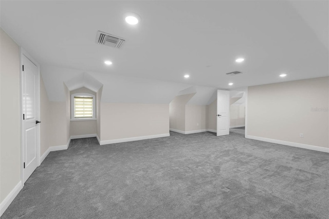 below grade area with baseboards, visible vents, carpet, and recessed lighting