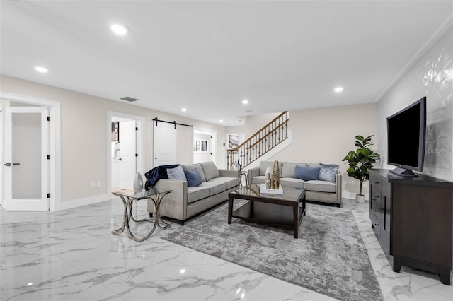 living room featuring marble finish floor, visible vents, a barn door, and stairway