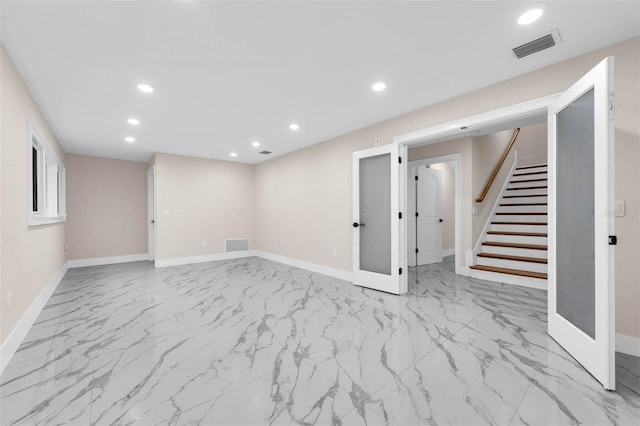 below grade area with baseboards, stairs, and recessed lighting
