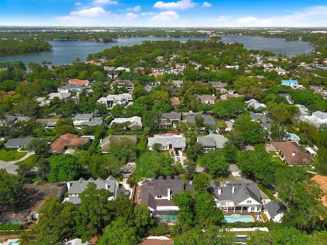 drone / aerial view featuring a residential view and a water view