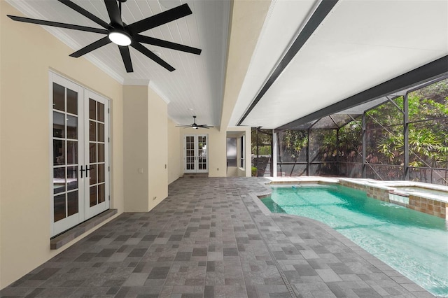 pool with a lanai, french doors, ceiling fan, an in ground hot tub, and a patio area