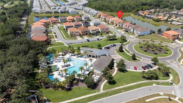 birds eye view of property featuring a water view