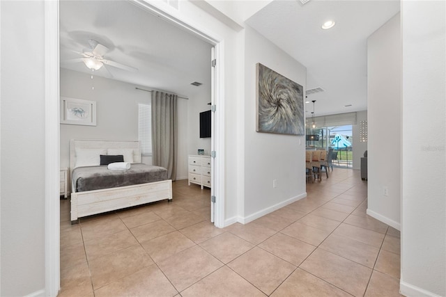 tiled bedroom with ceiling fan