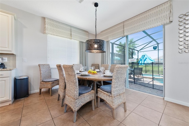 dining space featuring light tile patterned floors