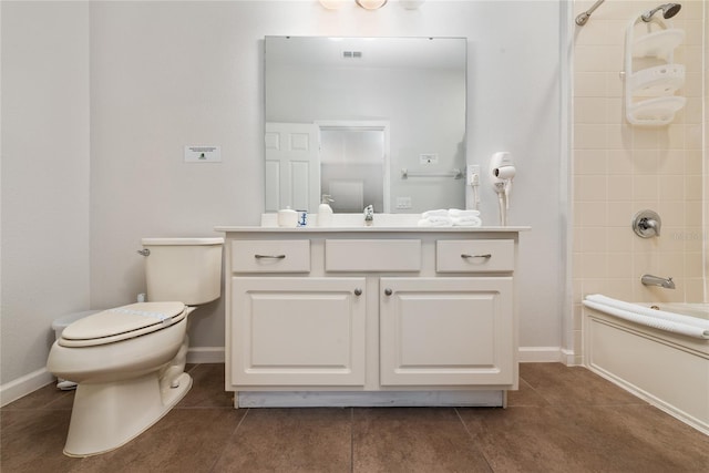 full bathroom featuring tile patterned floors, vanity, toilet, and tiled shower / bath