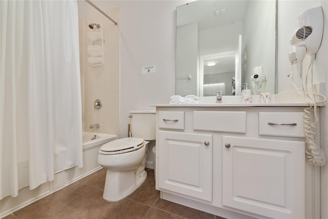 full bathroom featuring tile patterned floors, vanity, toilet, and shower / tub combo