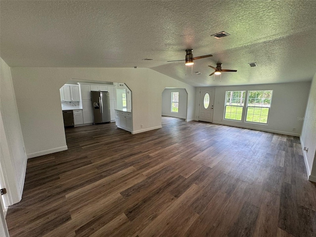 unfurnished living room featuring ceiling fan, lofted ceiling, and dark hardwood / wood-style flooring