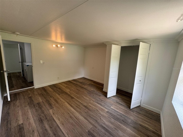 unfurnished bedroom featuring ornamental molding and dark hardwood / wood-style flooring