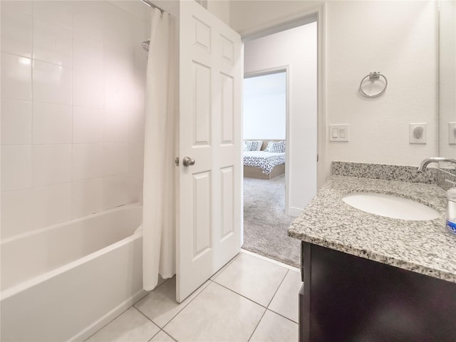 bathroom featuring tile patterned flooring, shower / bathtub combination with curtain, and vanity