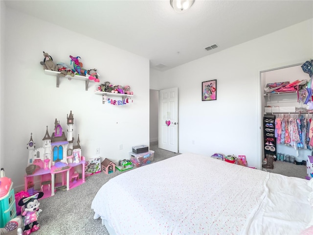 carpeted bedroom featuring a closet