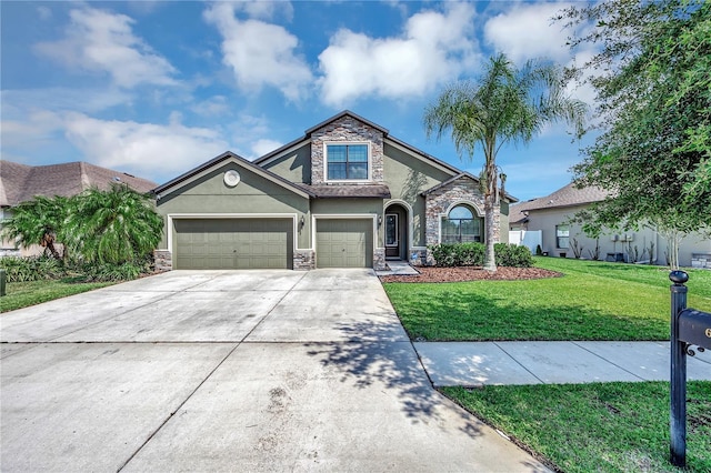 view of front of home with a front yard and a garage