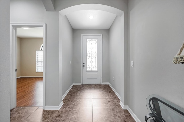 foyer entrance with tile patterned flooring