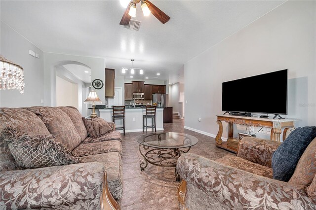 living room with ceiling fan