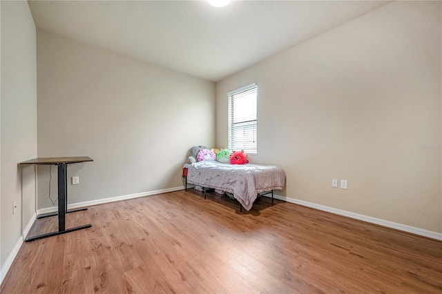 bedroom with light wood-type flooring