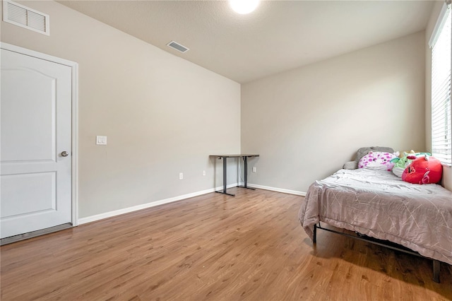 bedroom with light hardwood / wood-style flooring