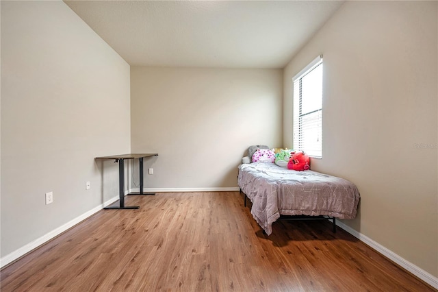 bedroom with light hardwood / wood-style floors