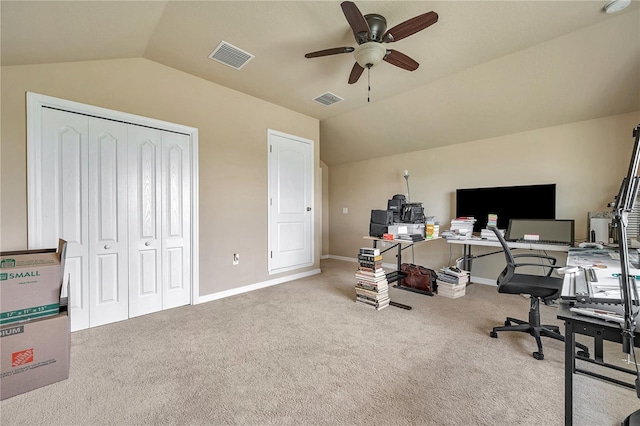 office area featuring ceiling fan, light colored carpet, and lofted ceiling