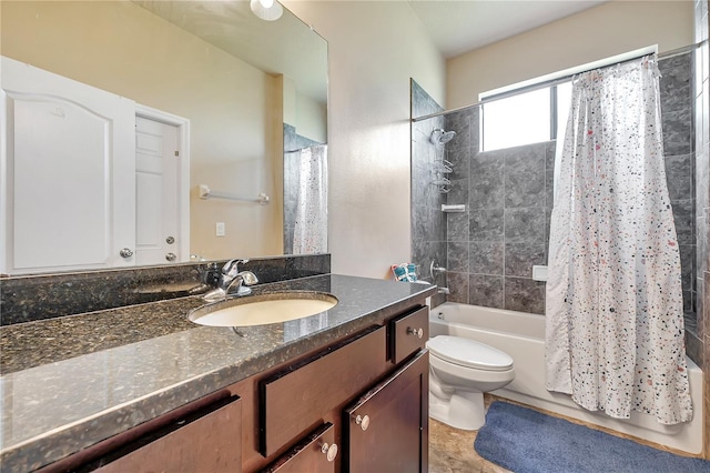 full bathroom with vanity, shower / bath combo, and toilet