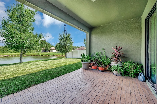 view of patio featuring a water view