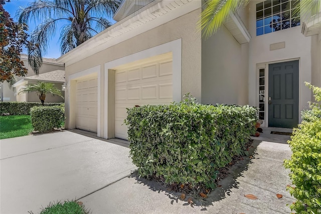 doorway to property with a garage