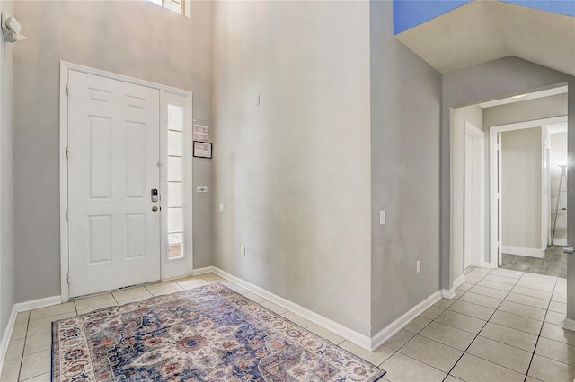 foyer entrance with light tile patterned floors