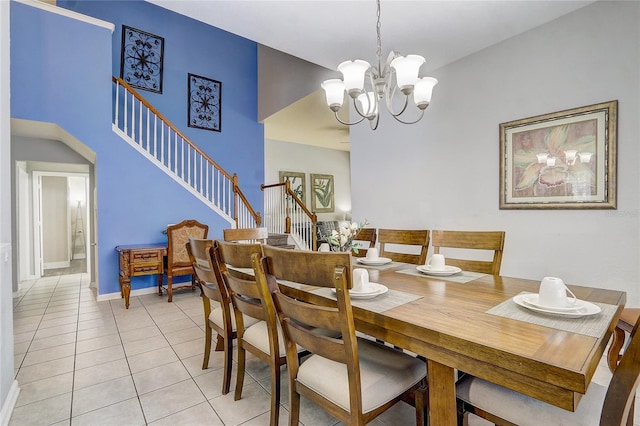 tiled dining area featuring a notable chandelier